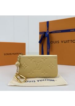 lv-pale-yellow-embossed-monogram-zip-key-pouch-pilvj01570-01